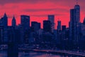 Colorful night lights shiningÃÂ with the Brooklyn Bridge and buildings of Manhattan in New York City with red and blue colors Royalty Free Stock Photo